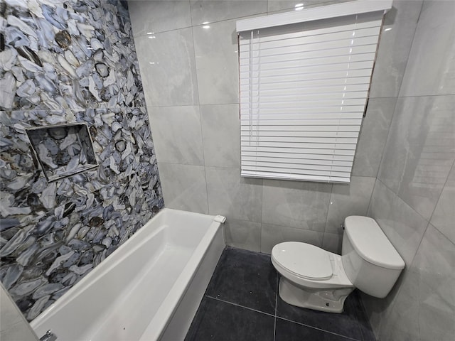 full bath featuring tile walls, tile patterned floors, and toilet