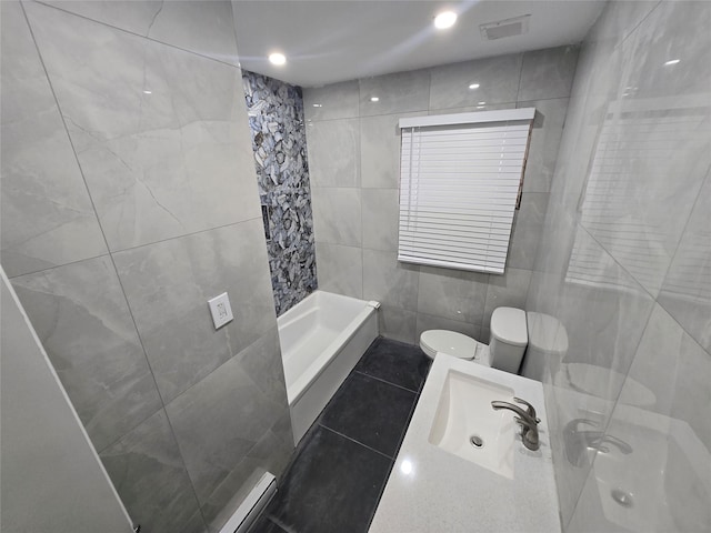 full bathroom with a shower, toilet, tile walls, tile patterned floors, and vanity