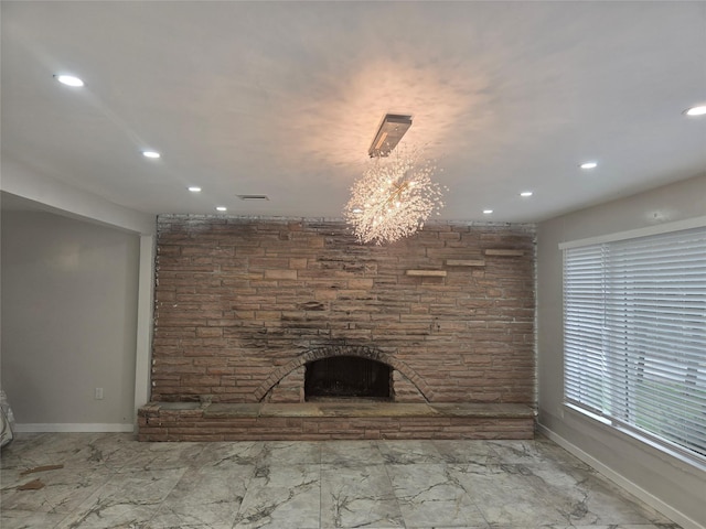 unfurnished living room featuring baseboards, recessed lighting, a fireplace, and marble finish floor