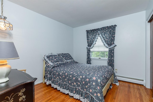 10 Dana Pl, Wappingers Falls, NY 12590 - bedroom featuring a baseboard radiator, wood finished floors, and baseboards