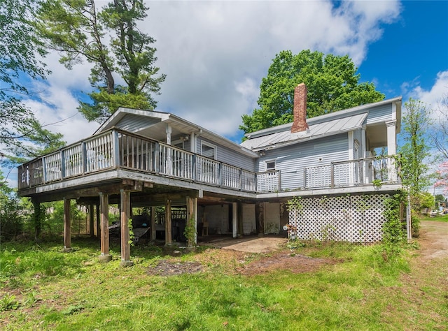1603 Goshen Tpke, Middletown, NY 10941 - back of house featuring a chimney, a wooden deck, and metal roof