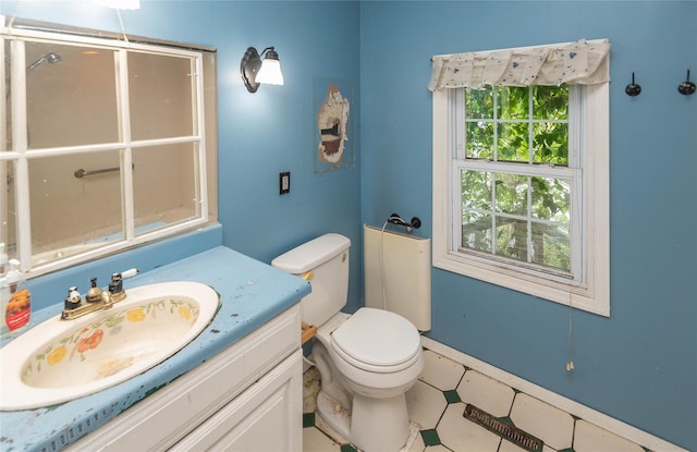 1603 Goshen Tpke, Middletown, NY 10941 - bathroom featuring toilet, vanity, and baseboards