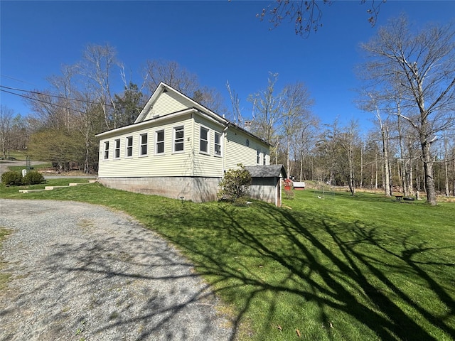 view of property exterior featuring a yard