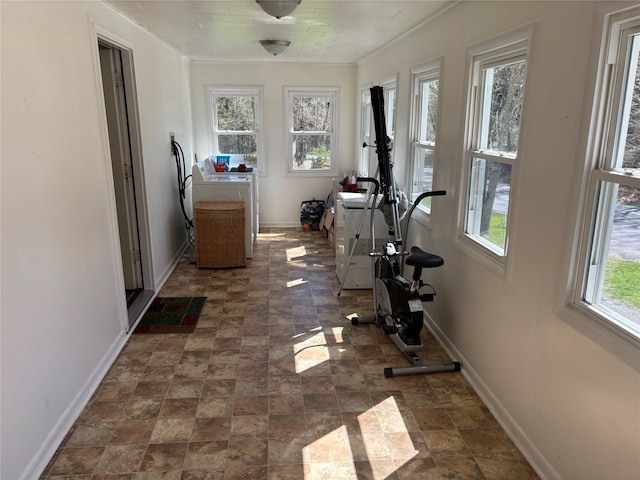 interior space featuring plenty of natural light, washer / clothes dryer, and baseboards
