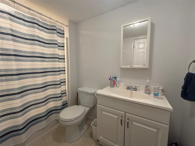 full bathroom with toilet, tile patterned floors, and vanity