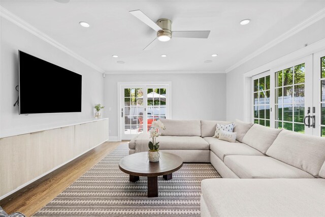 living room with crown molding, ceiling fan, recessed lighting, and wood finished floors