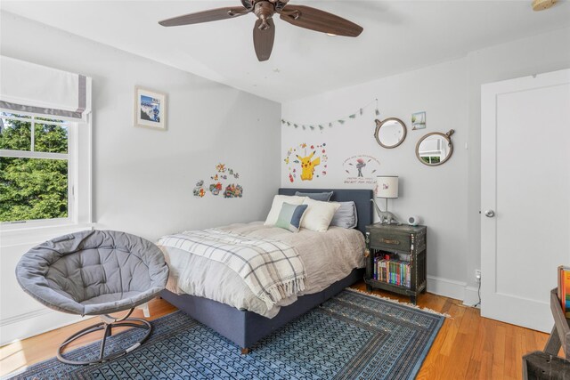 bedroom featuring ceiling fan and wood finished floors