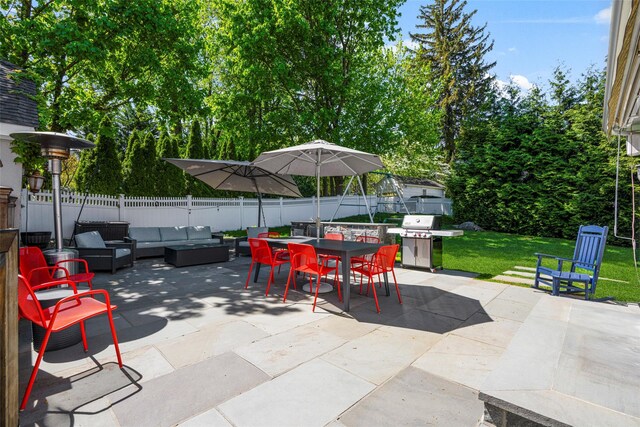 view of patio featuring a fenced backyard, an outdoor hangout area, outdoor dining space, and a grill
