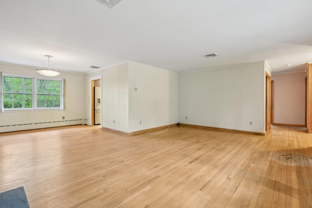 54 Cedar St, Stony Brook, NY 11790 - unfurnished living room with baseboard heating, light wood-type flooring, ornamental molding, and baseboards