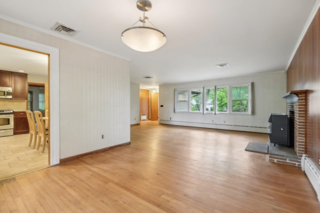 54 Cedar St, Stony Brook, NY 11790 - unfurnished living room featuring a baseboard radiator, light wood-style flooring, crown molding, a wood stove, and baseboards