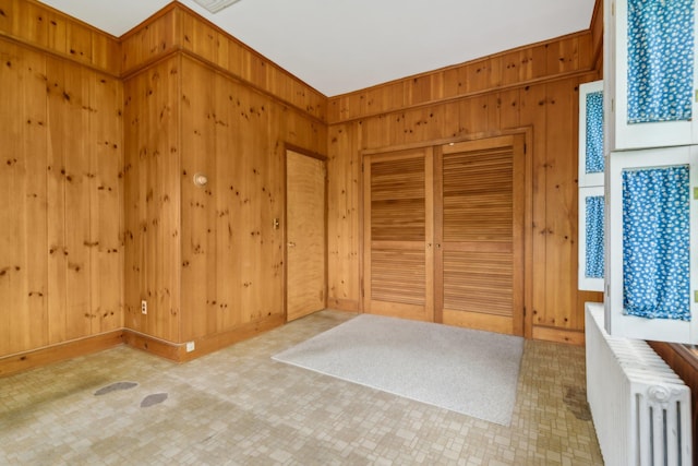 54 Cedar St, Stony Brook, NY 11790 - spare room with radiator and wood walls