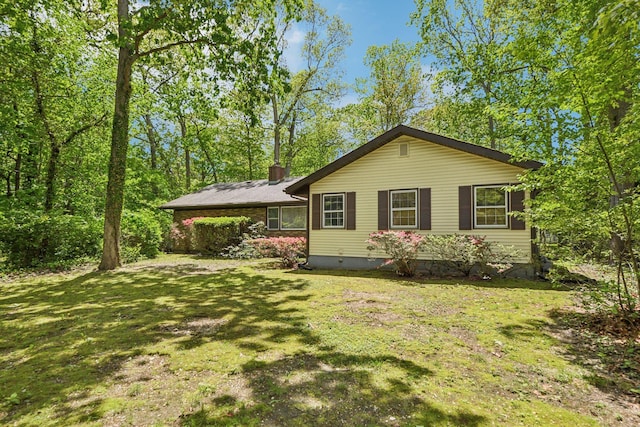 54 Cedar St, Stony Brook, NY 11790 - view of front of house featuring a front yard, a chimney, crawl space, and a carport