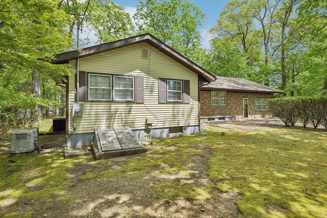 54 Cedar St, Stony Brook, NY 11790 - back of house with central AC unit and a patio area