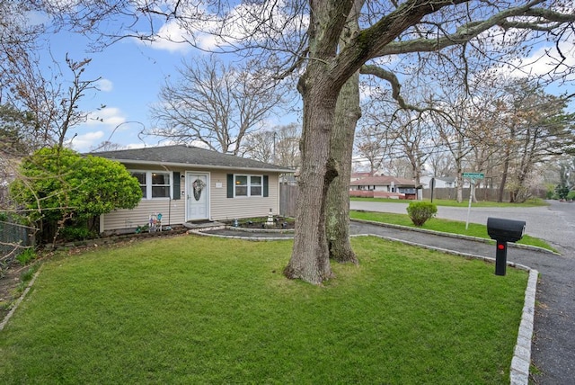 133 Parkwood Dr, Shirley, NY 11967 - view of front of property with fence and a front lawn