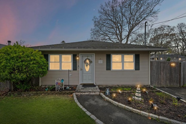 133 Parkwood Dr, Shirley, NY 11967 - view of front of house featuring fence and a lawn