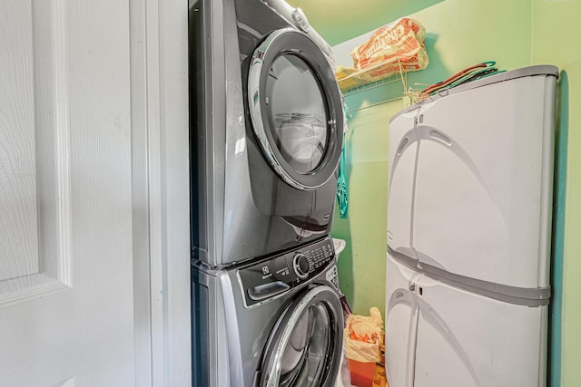 washroom featuring stacked washer and dryer