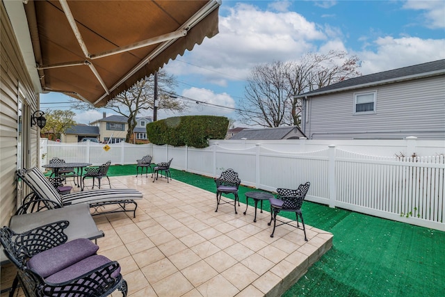 68 Lincoln Ave, Island Park, NY 11558 - view of patio with outdoor dining area and a fenced backyard