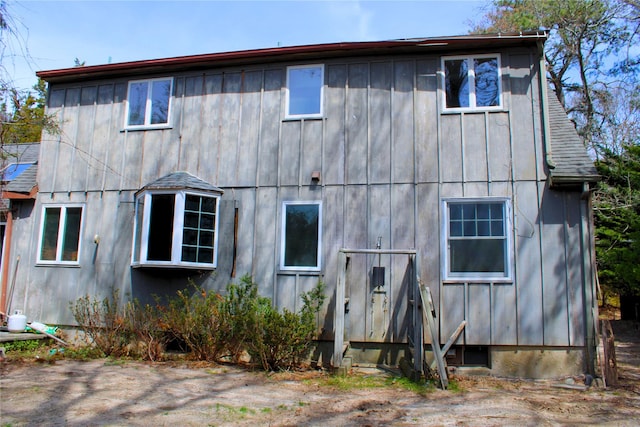 back of property featuring board and batten siding