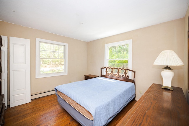 75 Squiretown Rd, Hampton Bays, NY 11946 - bedroom with a baseboard heating unit and wood finished floors