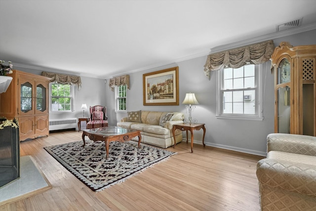 97 Highview Ave, Tuckahoe, NY 10707 - living area with radiator heating unit, ornamental molding, light wood-style flooring, and baseboards