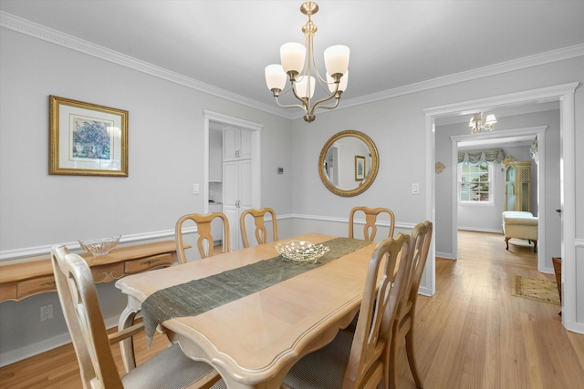 97 Highview Ave, Tuckahoe, NY 10707 - dining space with a chandelier, light wood-style floors, crown molding, and baseboards