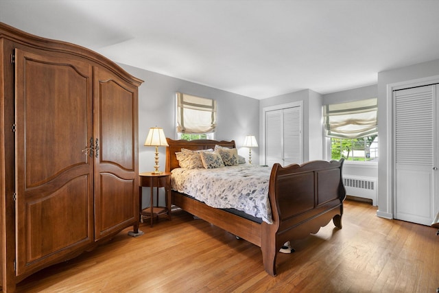 97 Highview Ave, Tuckahoe, NY 10707 - bedroom featuring radiator heating unit, multiple closets, and light wood-style floors