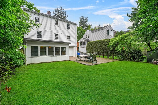 97 Highview Ave, Tuckahoe, NY 10707 - rear view of house featuring a lawn, a chimney, and a patio