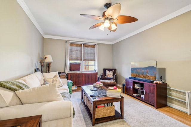 200 N Village Ave Unit D10, Rockville Centre, NY 11570 - living area featuring wood finished floors, a ceiling fan, radiator heating unit, and ornamental molding