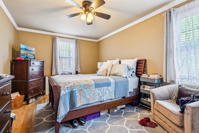 200 N Village Ave Unit D10, Rockville Centre, NY 11570 - bedroom with crown molding, ceiling fan, and wood finished floors