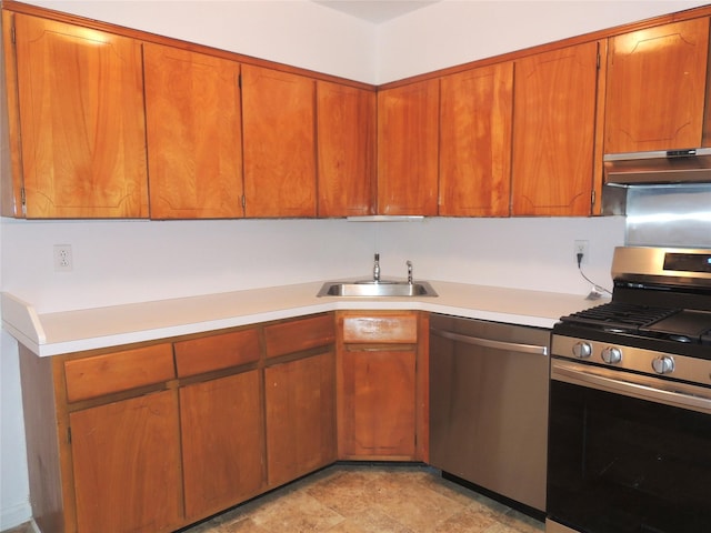 kitchen featuring a sink, brown cabinetry, stainless steel appliances, under cabinet range hood, and light countertops