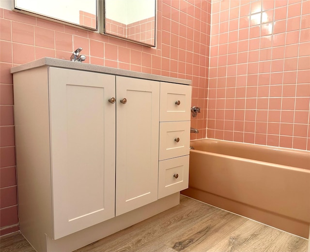 19 Maple Unit 2C, Hastings-On-Hudson, NY 10706 - bathroom featuring wood finished floors and shower / bath combination