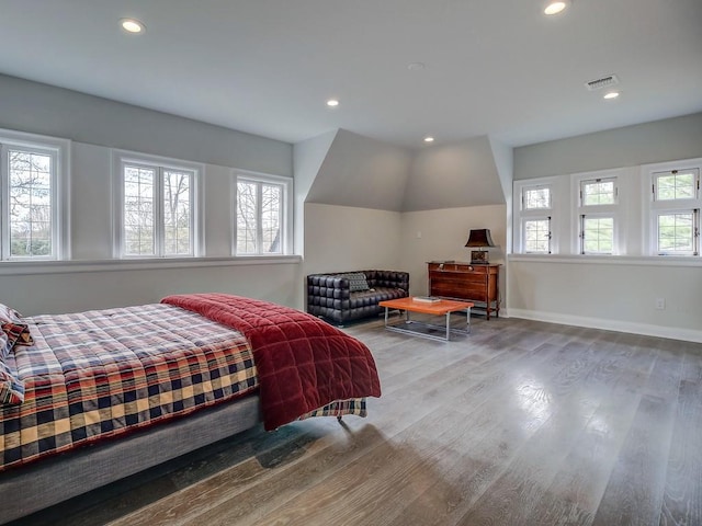 bedroom with recessed lighting, baseboards, visible vents, and wood finished floors