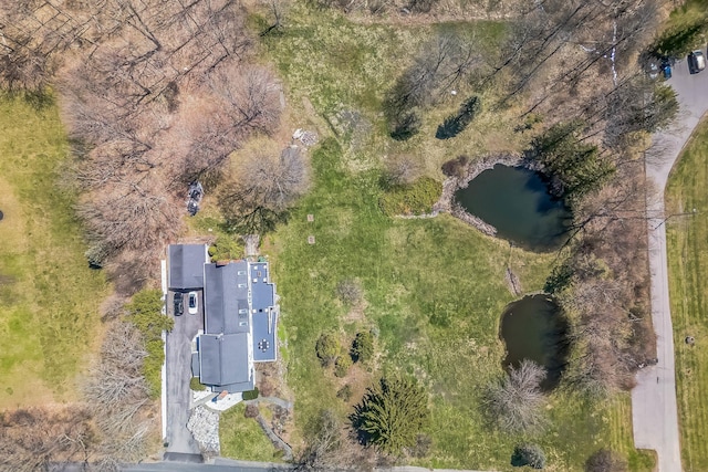 birds eye view of property featuring a water view