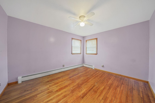 1036 Pacific St, Baldwin Harbor, NY 11510 - empty room with baseboards, ceiling fan, baseboard heating, and light wood-type flooring