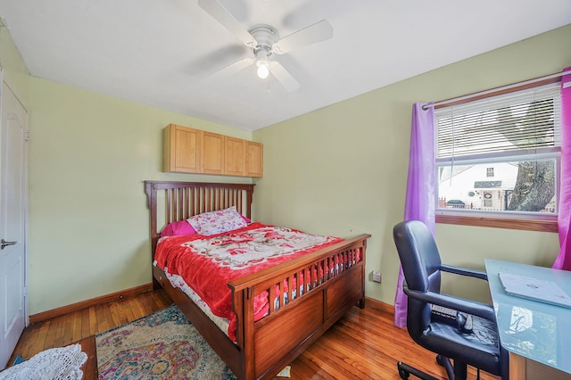 1036 Pacific St, Baldwin Harbor, NY 11510 - bedroom featuring a ceiling fan, baseboards, and wood finished floors