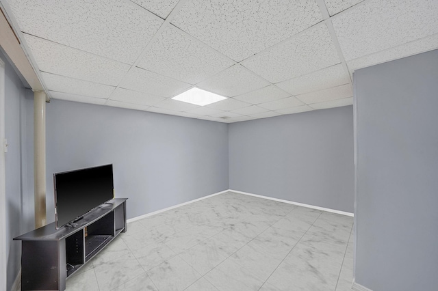 1036 Pacific St, Baldwin Harbor, NY 11510 - finished below grade area featuring baseboards, a paneled ceiling, and marble finish floor
