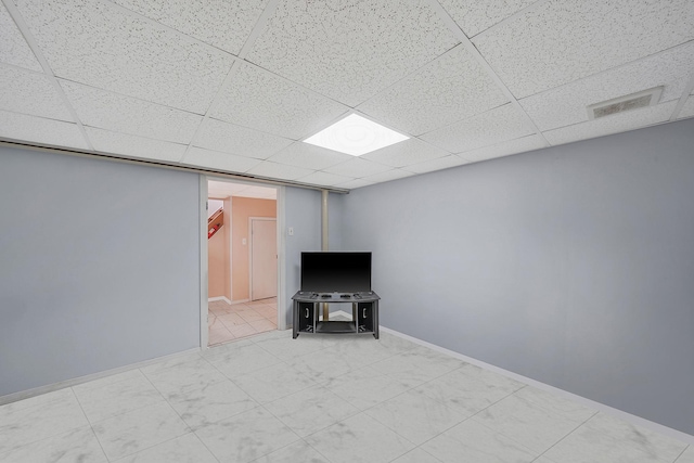 1036 Pacific St, Baldwin Harbor, NY 11510 - unfurnished living room featuring visible vents, baseboards, and a drop ceiling