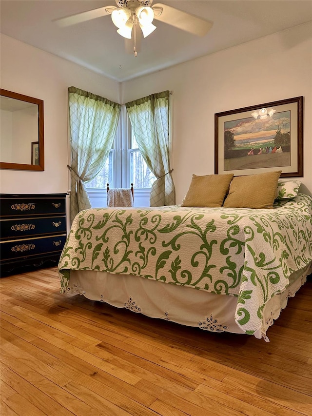 bedroom featuring ceiling fan and hardwood / wood-style floors