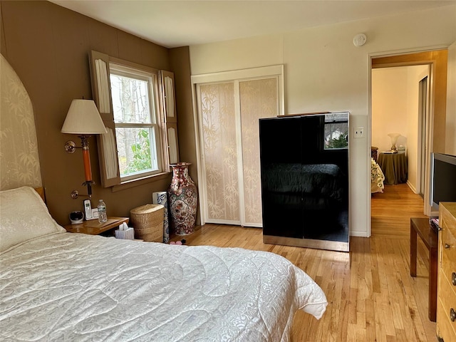 bedroom with a closet and wood finished floors