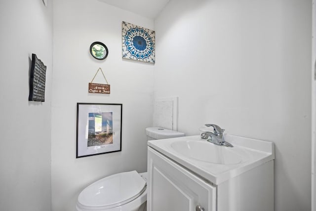 bathroom with toilet and vanity
