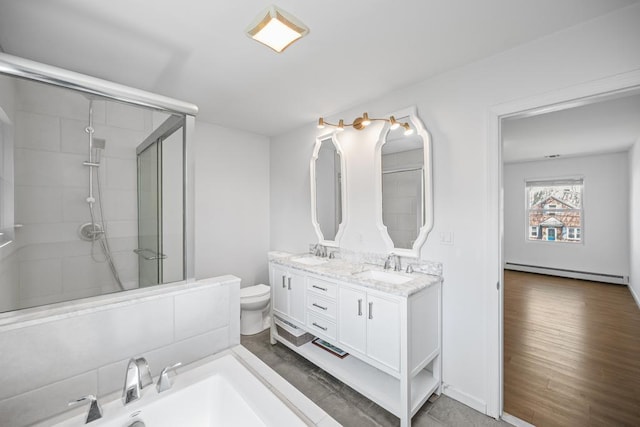 full bathroom with toilet, a stall shower, a sink, and baseboard heating