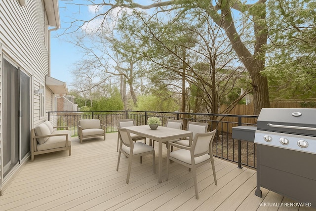 60 School St, Hampton Bays, NY 11946 - wooden terrace featuring area for grilling and outdoor dining space