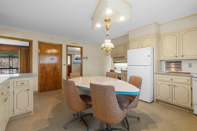 dining area featuring crown molding and recessed lighting
