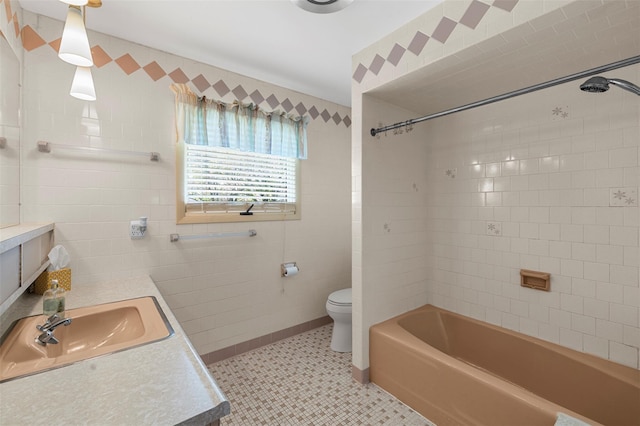 bathroom with shower / bathtub combination, tile patterned floors, vanity, and toilet