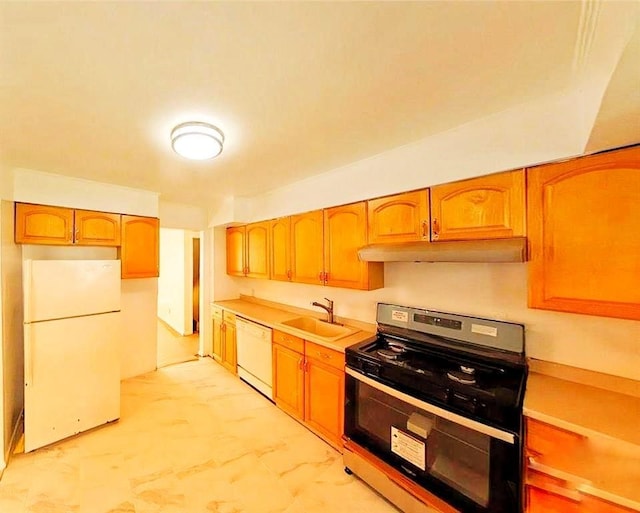 kitchen with white appliances, under cabinet range hood, light countertops, and a sink