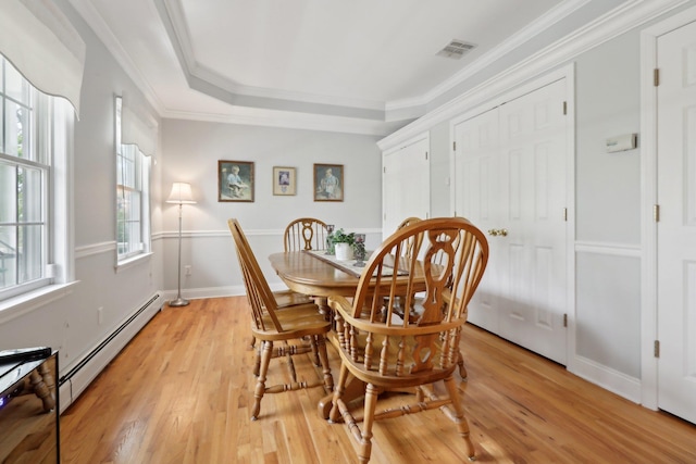 27 Lindbergh Ln, New City, NY 10956 - dining space with visible vents, ornamental molding, baseboards, a baseboard heating unit, and light wood finished floors