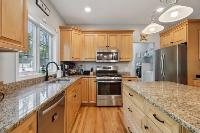 27 Lindbergh Ln, New City, NY 10956 - kitchen featuring stainless steel appliances, light stone countertops, a sink, and light brown cabinets