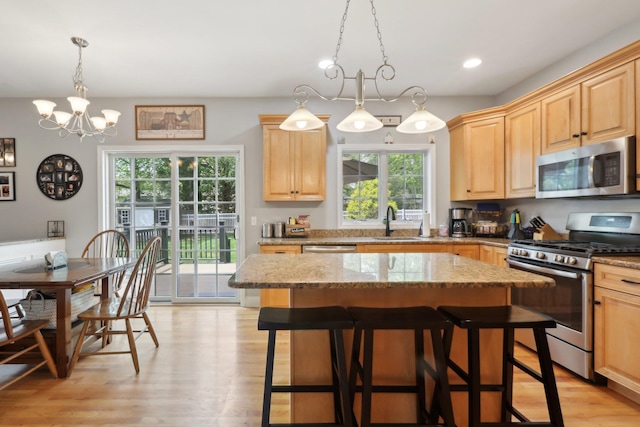 27 Lindbergh Ln, New City, NY 10956 - kitchen with stainless steel appliances, light wood-style floors, a sink, and light brown cabinets