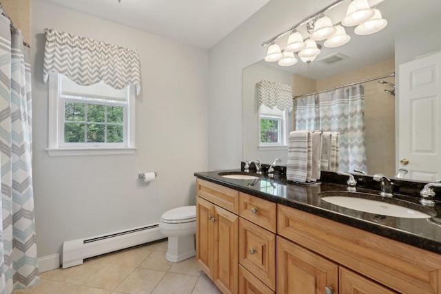 27 Lindbergh Ln, New City, NY 10956 - bathroom with toilet, a sink, plenty of natural light, and baseboard heating