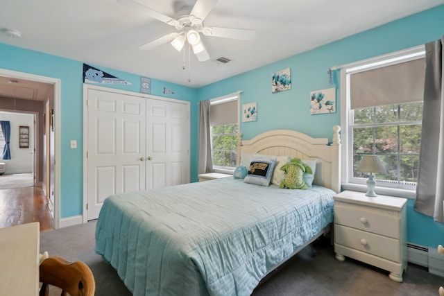 27 Lindbergh Ln, New City, NY 10956 - carpeted bedroom featuring ceiling fan, visible vents, attic access, a baseboard heating unit, and a closet